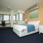 A Studio room featuring a double bed and air-conditioning